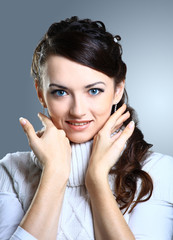 Portrait of a beautiful woman on a black background
