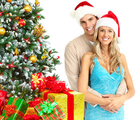 Happy couple near Christmas Tree.