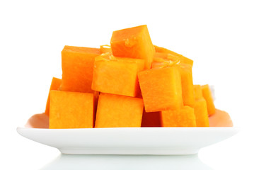 sliced pumpkin on plate isolated on white