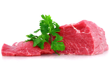 Cut of  beef steak with green leaf. Isolated.