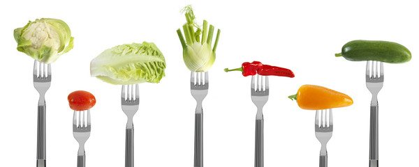 fresh baby vegetables on forks
