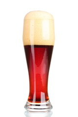 red beer with foam in glass isolated on white
