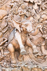 Traditional Thai style old iron statue plate in thai temple.