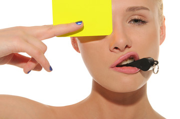 beautiful woman with whistle and yellow card