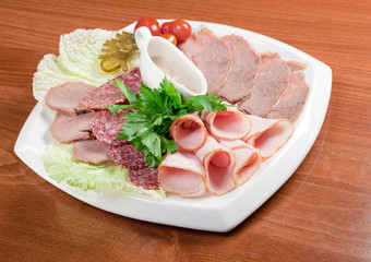 sliced food  meat and sausage arrangement .