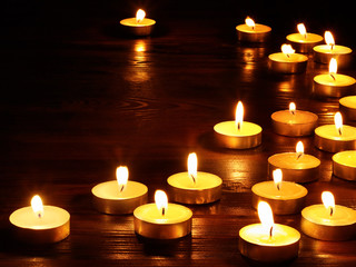 Group of  candles on  black background.