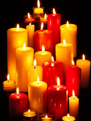 Group of  candles on  black background.