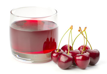 Cherries and a glass of cherry juice isolated on white