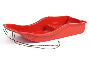 Fotobehang Plastic red sled for skiing on white background © afxhome