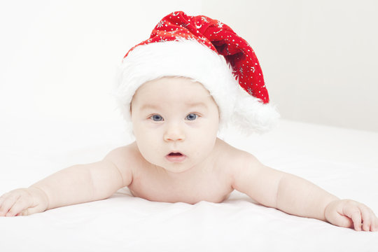 sweet baby in Santa's hat