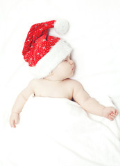 sleeping baby in santa's hat