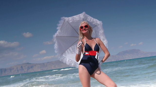 Beautiful young woman having fun on the beach