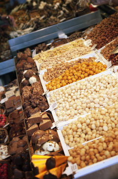 Stall with chocolates candy at Boqueria Market in Barcelona.