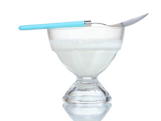 Sour cream in bowl and spoon isolated on white