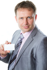 business man in stylish suit holding blank business card