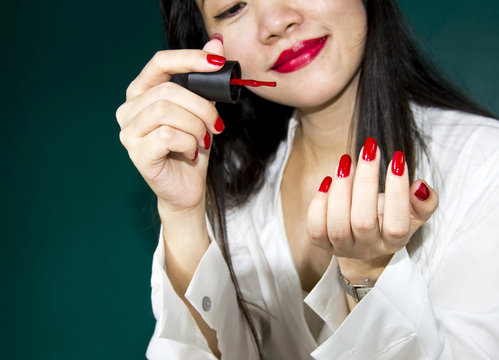 woman's hand and red lacquer