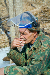 Worker smoking in forest 2