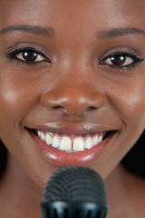 Close up of cheerful smiling female singer