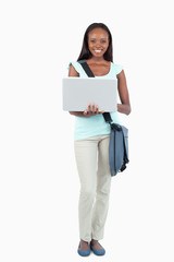 Smiling young student with her notebook