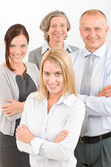 Business team young woman with mature colleagues