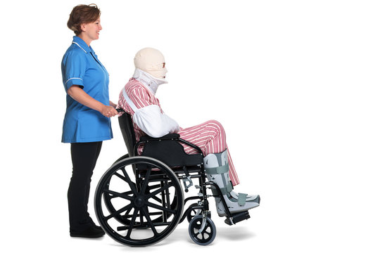 Injured man in wheelchair with nurse