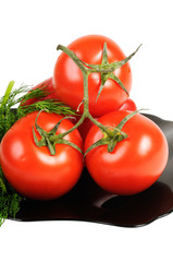 Tomatoes on a black plate