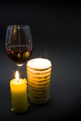 Glass of red wine and candle