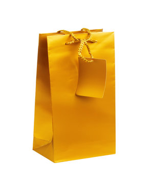 Golden gift shopping bag isolated on white