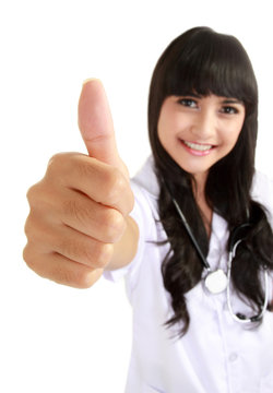 Happy female doctor with thumb up