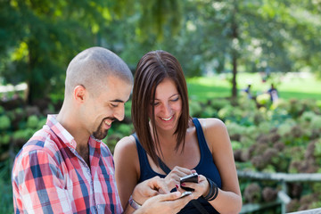 Happy Couple with Mobile Phone