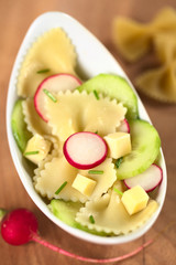 Pasta salad with cucumber, radish, cheese and chives