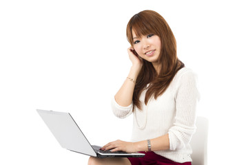 Naklejka premium Beautiful asian woman using a laptop computer