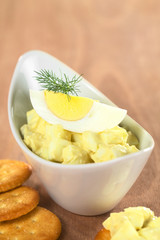 Egg salad garnished with boiled egg and dill