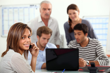 Fototapeta premium woman advising a group of people possibly a family