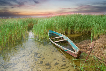 Boat at coast against a coming nearer thunder-storm