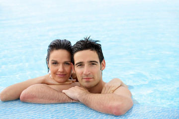 Portrait of a couple at a poolside