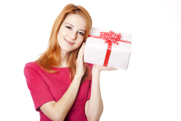 Red-haired girl in dress with present box