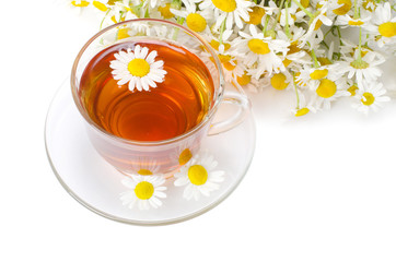 Glass cup with a camomile tea