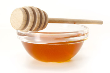 Honey in bowl with wood stick