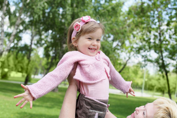 Grandmother with her granddaughter outdoors