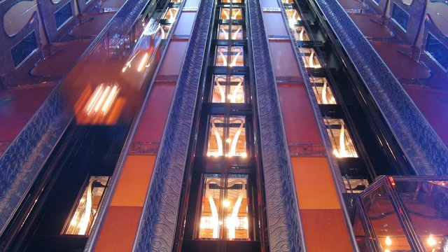Elevators operate inside cruise liner, time lapse