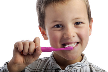 little boy cleaning his teeth