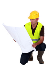Foreman watching a blueprint