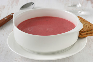 beet soup in white bowl