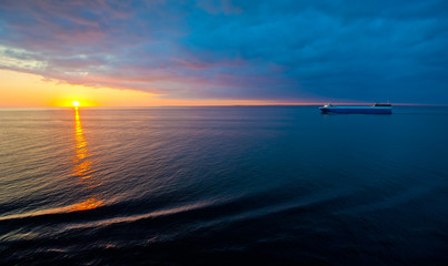 cruise liner in the sea at sunset