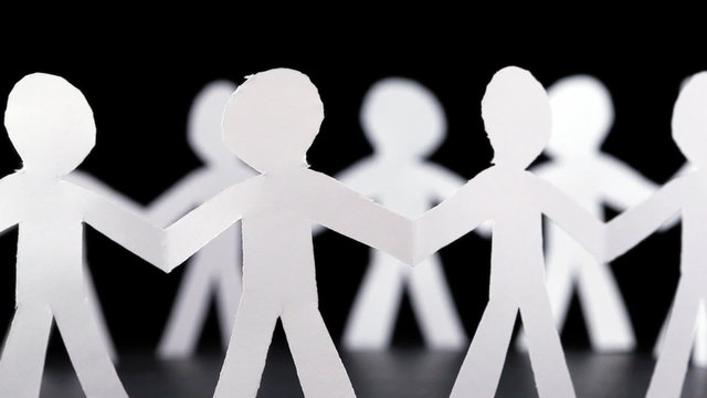 paper people stand in circle and hold hands, rotates on black