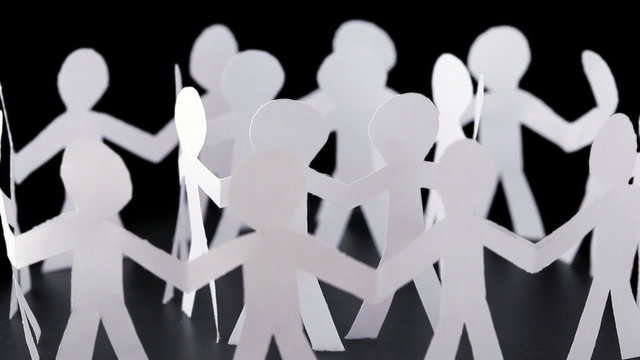paper people stand in two circles and hold hands, rotates
