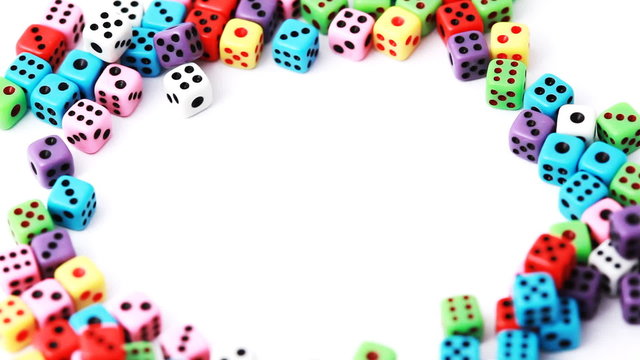 many dice stacked in circle rotate on white, close-up