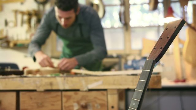italian artisan working in lutemaker workshop