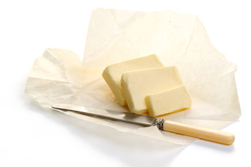 Butter on paper and knife